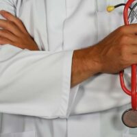 doctor holding stethoscope doctor holding stethoscope